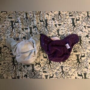 Pair of Grovia all-in-one diapers